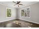 Bright bedroom with hardwood floors, ceiling fan and two windows at 3213 Woodlynne Way, Atlanta, GA 30340