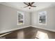 Bright bedroom with hardwood floors and two large windows at 3213 Woodlynne Way, Atlanta, GA 30340