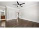 Bedroom with hardwood floors, ceiling fan, and access to bathroom at 3213 Woodlynne Way, Atlanta, GA 30340