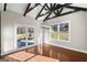 Bright dining room features hardwood floors, exposed beams, and sliding glass doors to the patio at 3213 Woodlynne Way, Atlanta, GA 30340