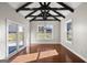 Bright dining room features hardwood floors, exposed beams, and sliding glass doors to the patio at 3213 Woodlynne Way, Atlanta, GA 30340