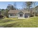 House exterior showcasing a rear view with patio and landscaping at 3213 Woodlynne Way, Atlanta, GA 30340