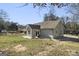 House exterior showcasing a rear view with patio and landscaping at 3213 Woodlynne Way, Atlanta, GA 30340