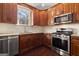 Modern kitchen with wood cabinets, granite countertops and stainless steel appliances at 3213 Woodlynne Way, Atlanta, GA 30340