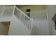 White staircase with a classic design and railing at 267 Bella Vista Ter, Mcdonough, GA 30253