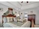 Main bedroom with tray ceiling, wood furniture and en suite bath at 123 Courtneys Ln, Fayetteville, GA 30215