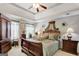 Main bedroom with tray ceiling and wood furniture at 123 Courtneys Ln, Fayetteville, GA 30215