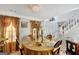 Elegant dining room features a table set for a meal, and a view of the staircase at 123 Courtneys Ln, Fayetteville, GA 30215