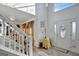 Two-story foyer with hardwood floors and a staircase at 123 Courtneys Ln, Fayetteville, GA 30215