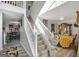 Two-story foyer with a staircase and chair lift at 123 Courtneys Ln, Fayetteville, GA 30215