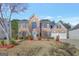 Brick two-story house with a two-car garage and landscaped lawn at 123 Courtneys Ln, Fayetteville, GA 30215