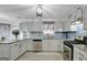 Modern kitchen with granite countertops and stainless steel appliances at 123 Courtneys Ln, Fayetteville, GA 30215