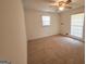 Well-lit bedroom with neutral carpeting and window blinds at 1753 Brenda Dr, Jonesboro, GA 30236