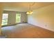 Bright dining room with neutral carpeting and large windows at 1753 Brenda Dr, Jonesboro, GA 30236