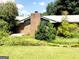 Brick house exterior with a chimney and partial patio view at 1753 Brenda Dr, Jonesboro, GA 30236