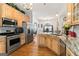 Modern kitchen featuring stainless steel appliances, granite countertops and open to dining room at 3806 Bill Gardner Pkwy, Locust Grove, GA 30248