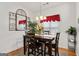 Inviting dining room with a wooden table, chairs, and decorative mirror at 3806 Bill Gardner Pkwy, Locust Grove, GA 30248
