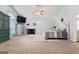 Bright main bedroom with a king bed, fireplace, and vaulted ceilings at 3806 Bill Gardner Pkwy, Locust Grove, GA 30248