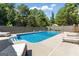 Backyard with a private swimming pool and lounge chairs at 3806 Bill Gardner Pkwy, Locust Grove, GA 30248
