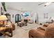 Spacious living room with fireplace, comfortable sofas, and stylish décor creating a welcoming atmosphere at 3806 Bill Gardner Pkwy, Locust Grove, GA 30248