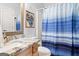 Neutral bathroom featuring a vanity with granite countertop and a tub with shower at 3806 Bill Gardner Pkwy, Locust Grove, GA 30248