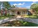 Beautiful home featuring a welcoming front porch with stately columns and an inviting entry at 3806 Bill Gardner Pkwy, Locust Grove, GA 30248