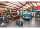 Spacious garage or workshop, featuring a car lift, ample storage, and room for projects at 3806 Bill Gardner Pkwy, Locust Grove, GA 30248