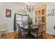 Elegant dining room with chandelier, large window, and charming décor at 3806 Bill Gardner Pkwy, Locust Grove, GA 30248