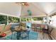 Charming sunroom with pool views, a ceiling fan, and ample seating at 3806 Bill Gardner Pkwy, Locust Grove, GA 30248