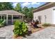Outdoor space with a firepit, seating, and decorative landscaping at 3806 Bill Gardner Pkwy, Locust Grove, GA 30248