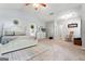 Bright main bedroom with a king bed, fireplace, and vaulted ceilings at 3806 Bill Gardner Pkwy, Locust Grove, GA 30248