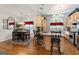 Bright kitchen featuring stainless steel appliances, island with seating, and hardwood floors at 3806 Bill Gardner Pkwy, Locust Grove, GA 30248