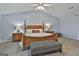 Main bedroom with a large bed and wooden furniture at 2984 Walt Stephens Rd, Jonesboro, GA 30236