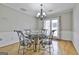 Dining room with hardwood floors and glass-top dining table at 2984 Walt Stephens Rd, Jonesboro, GA 30236