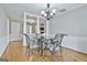 Bright dining room with glass-top table and chandelier at 2984 Walt Stephens Rd, Jonesboro, GA 30236