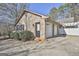 Two-car brick garage with white doors at 2984 Walt Stephens Rd, Jonesboro, GA 30236