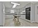 Kitchen with gray cabinets and granite countertop island at 2984 Walt Stephens Rd, Jonesboro, GA 30236