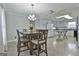 Kitchen with gray cabinets, granite island, and tile floor at 2984 Walt Stephens Rd, Jonesboro, GA 30236