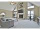 Living room with a fireplace, large windows, and vaulted ceiling at 2984 Walt Stephens Rd, Jonesboro, GA 30236