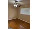 Bedroom with hardwood floor, ceiling fan, and window with blinds at 1310 Celia Way, Decatur, GA 30032