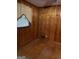 Cozy bedroom with wood paneling and hardwood floors at 1310 Celia Way, Decatur, GA 30032