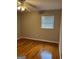 Bedroom with hardwood floors, ceiling fan, and window blinds at 1310 Celia Way, Decatur, GA 30032