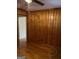 Bedroom with wood paneled walls and hardwood floors at 1310 Celia Way, Decatur, GA 30032