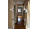 Hallway with hardwood floors and access to bedrooms at 1310 Celia Way, Decatur, GA 30032