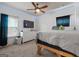 Spacious bedroom with a comfortable bed, dresser, and TV at 101 Elite Way, Mcdonough, GA 30252