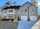 Two-story house with gray siding, white accents, and a three-car garage at 3279 Greenhill Dr, Villa Rica, GA 30180