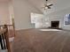 Spacious living room with a stone fireplace and access to a sunroom at 3279 Greenhill Dr, Villa Rica, GA 30180