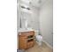 Clean bathroom with wood vanity and updated fixtures at 5260 Shirewick Dr, Lithonia, GA 30058