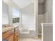 Bathroom with bathtub, shower, and double vanity at 5260 Shirewick Dr, Lithonia, GA 30058