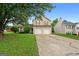 Two-story house with a two-car garage and large front yard at 5260 Shirewick Dr, Lithonia, GA 30058